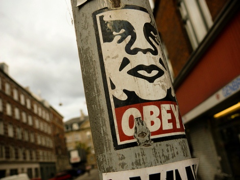 One of the stickers pasted on an urban space.